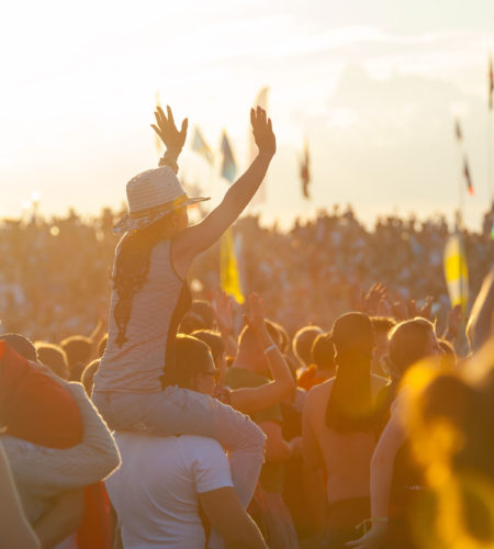 BIG ZAVIDOVO, RUSSIA - JULY 5: People cheering at open-air rock festival "Nashestvie" on July 5, 2014 in Big Zavidovo, Russia. "Nashestvie" is the biggest rock festival in Russia, more 200000 visitors